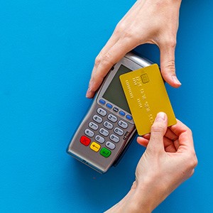 Person using card at POS machine