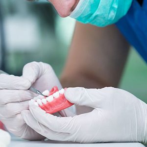 Dental lab technician working on dentures