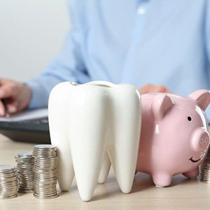 Man budgeting for the cost of dental care